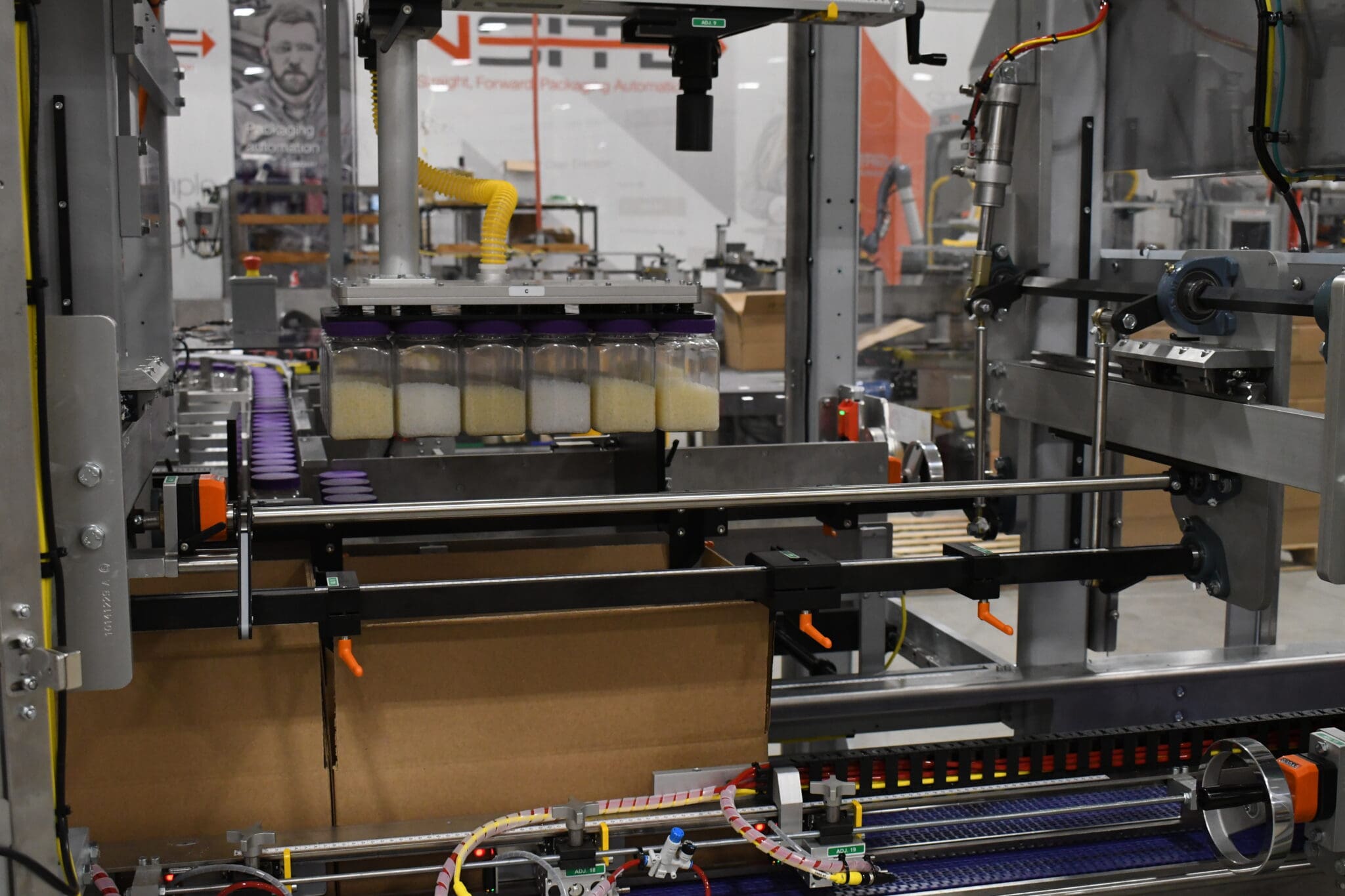 Sqround bottles being loaded in a case